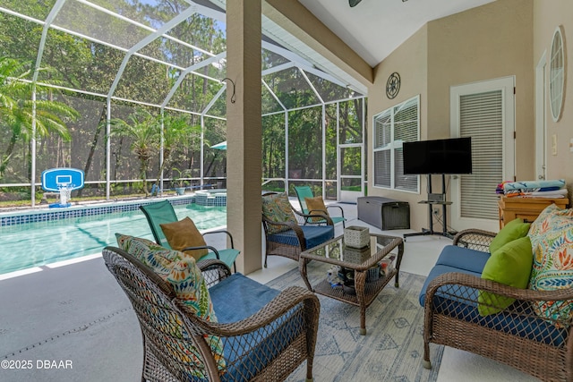 view of patio with an outdoor hangout area, glass enclosure, and a pool with connected hot tub