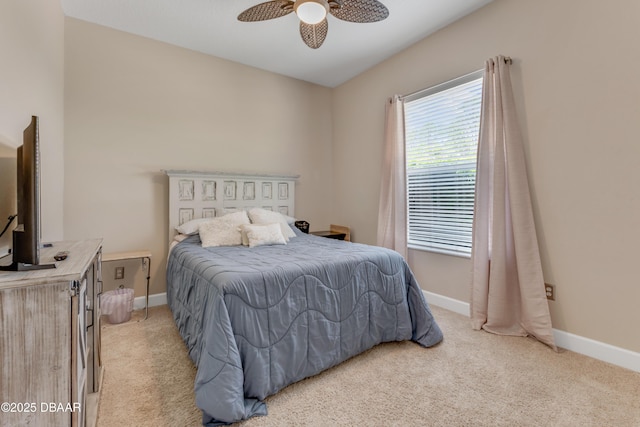 bedroom with light carpet, baseboards, and ceiling fan