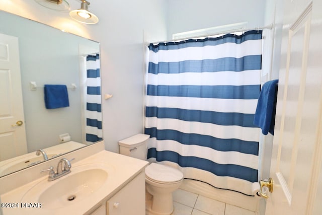 bathroom with vanity, walk in shower, tile patterned floors, and toilet