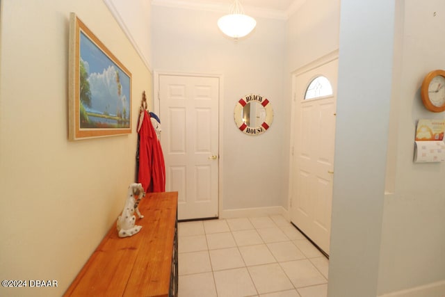 tiled foyer with crown molding