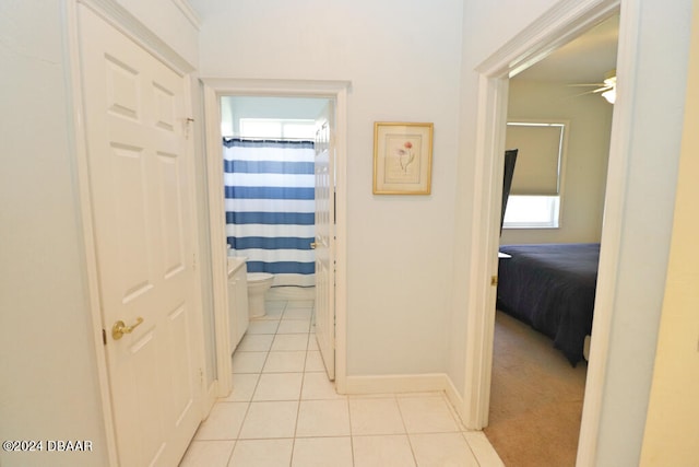 corridor with light tile patterned floors