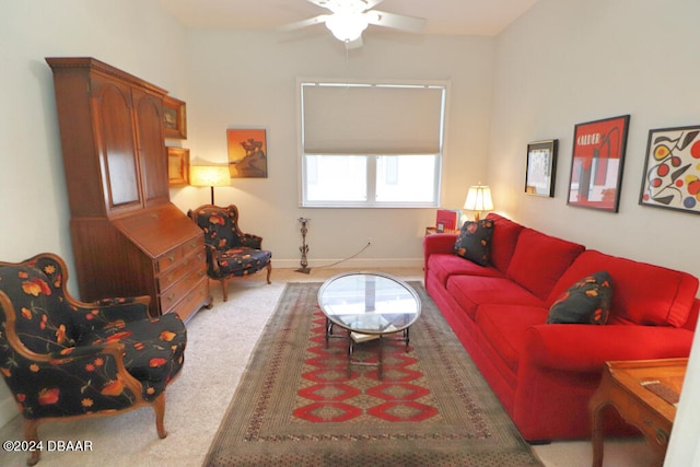 carpeted living room featuring ceiling fan