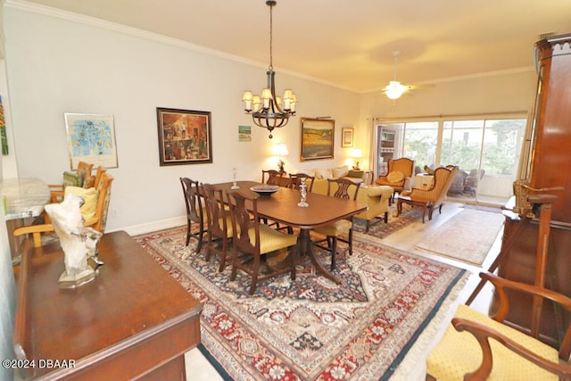 dining room featuring ornamental molding and ceiling fan with notable chandelier