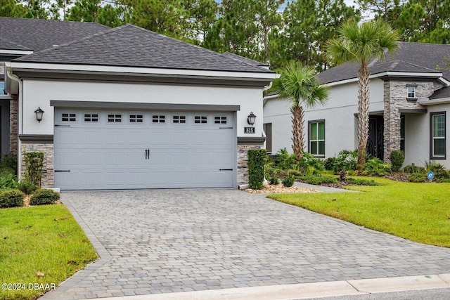 view of front facade featuring a front lawn and a garage