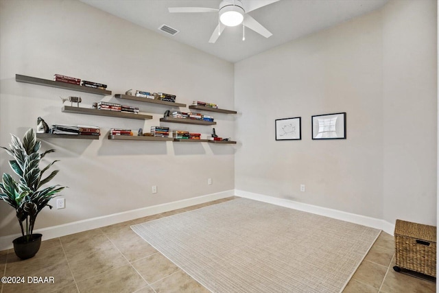 interior space with ceiling fan and light tile patterned floors