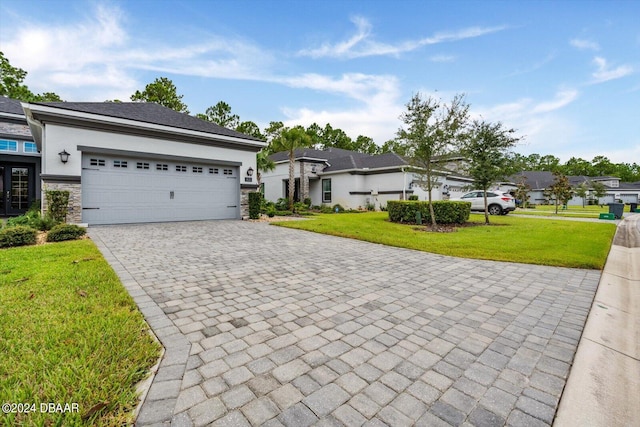 single story home featuring a front yard and a garage