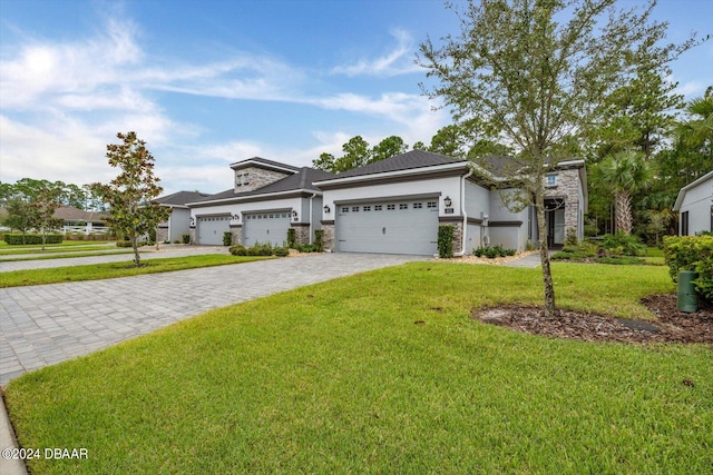 view of front facade with a garage and a front yard