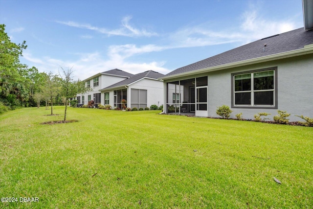 view of yard featuring a sunroom