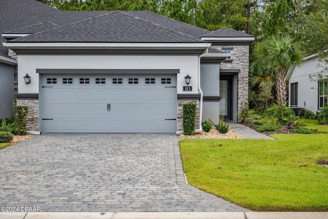 view of front of house with a front lawn and a garage