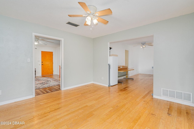 spare room with light hardwood / wood-style floors