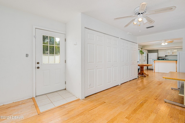 entrance foyer with light hardwood / wood-style flooring