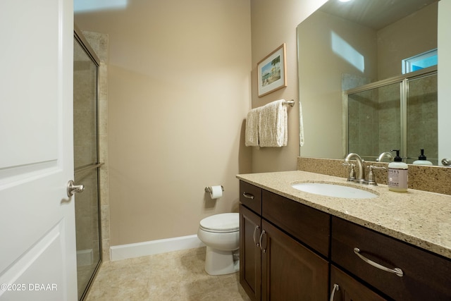 bathroom with vanity, an enclosed shower, and toilet