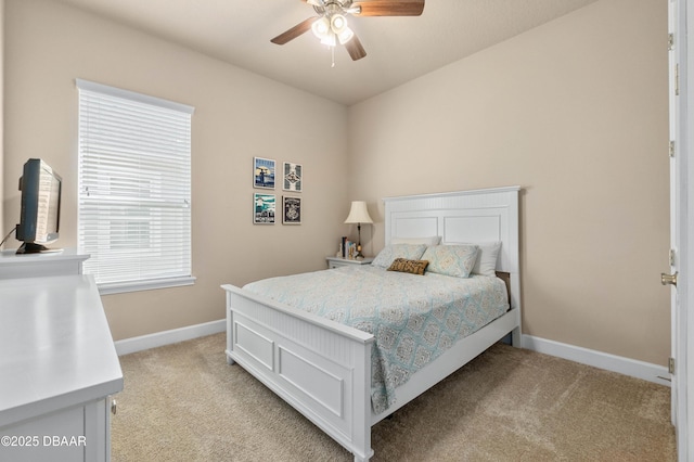 bedroom featuring ceiling fan and light colored carpet