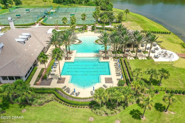 birds eye view of property with a water view