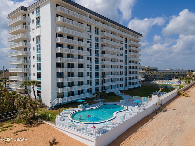 view of property featuring a community pool