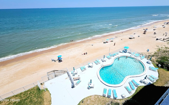 aerial view with a view of the beach and a water view