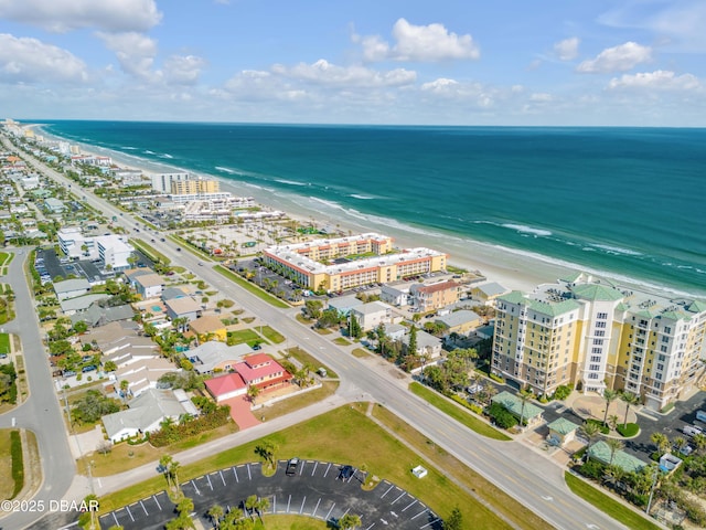 aerial view featuring a water view and a view of the beach
