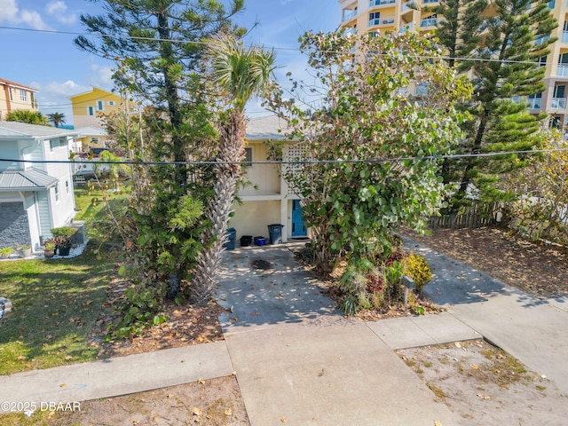 view of property hidden behind natural elements