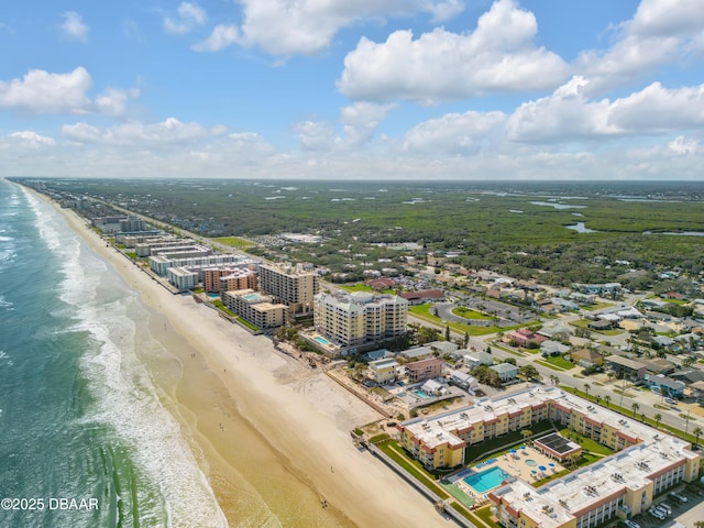 drone / aerial view featuring a view of the beach and a water view