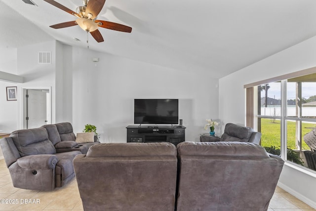 living room with visible vents, baseboards, lofted ceiling, ceiling fan, and light tile patterned flooring