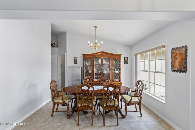 dining space with vaulted ceiling, light tile patterned floors, and a chandelier