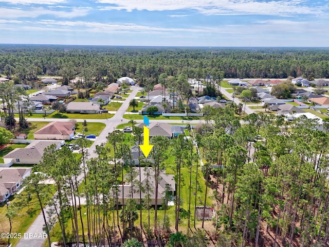 bird's eye view with a residential view and a view of trees