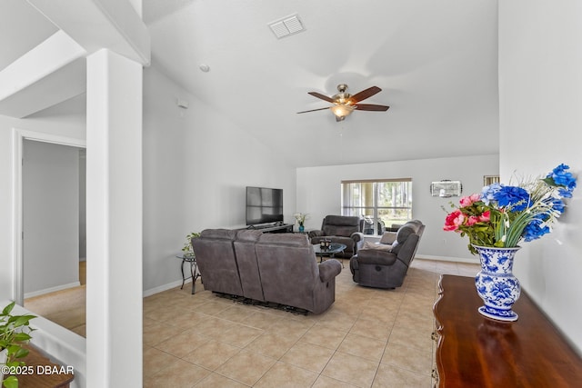 living room featuring lofted ceiling, ceiling fan, light tile patterned flooring, visible vents, and baseboards