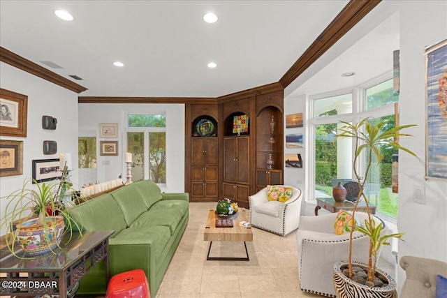 living room with a wealth of natural light, light tile patterned floors, and crown molding