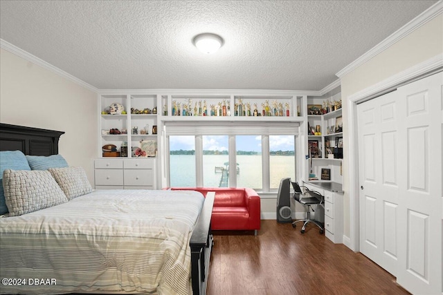 bedroom with a water view, ornamental molding, dark hardwood / wood-style floors, a textured ceiling, and a closet