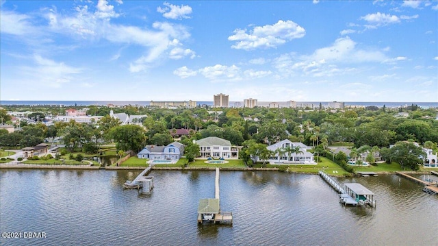 birds eye view of property with a water view