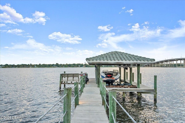 dock area with a water view