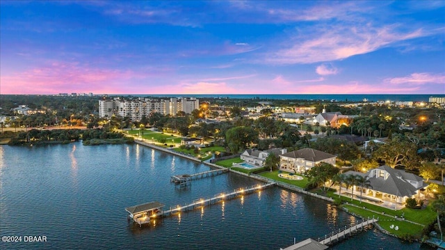 aerial view at dusk with a water view