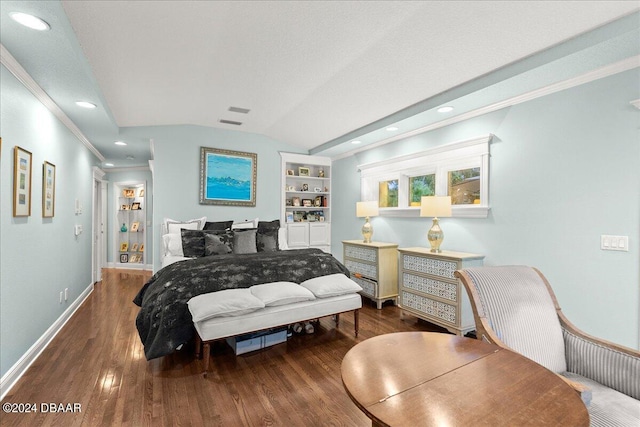 bedroom with dark hardwood / wood-style flooring, lofted ceiling, and ornamental molding