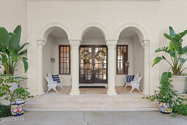 entrance to property with french doors and covered porch