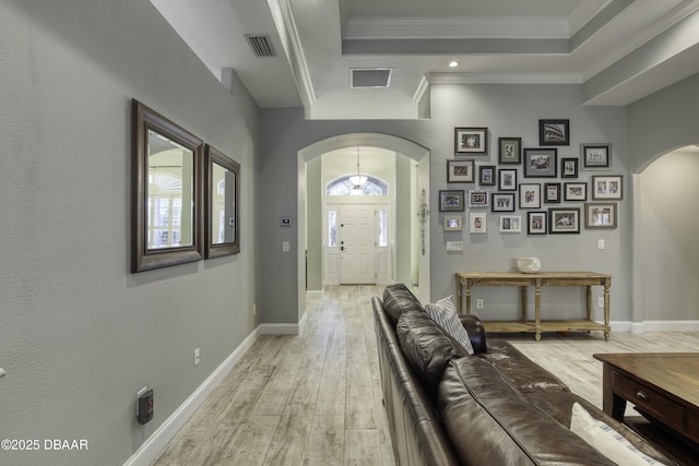 entryway featuring light hardwood / wood-style flooring and ornamental molding