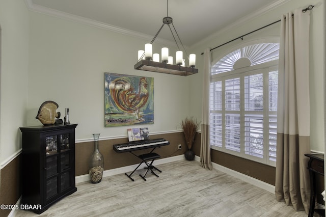 interior space with a notable chandelier, crown molding, and light hardwood / wood-style flooring