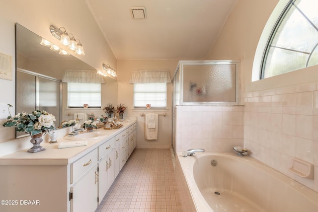 7 Fernery Trl, Ormond Beach, FL 32174 - full bath featuring a stall shower, a bath, tile patterned flooring, and double vanity