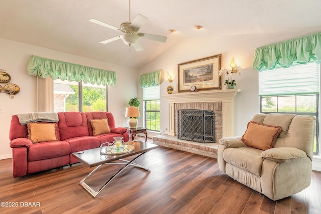 7 Fernery Trl, Ormond Beach, FL 32174 - living room featuring a fireplace, vaulted ceiling, wood finished floors, and a ceiling fan