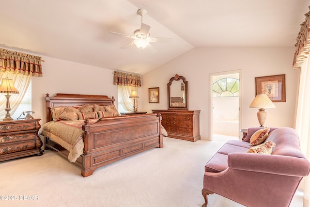 7 Fernery Trl, Ormond Beach, FL 32174 - bedroom with light colored carpet, vaulted ceiling, ensuite bath, and ceiling fan