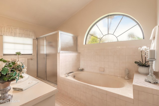7 Fernery Trl, Ormond Beach, FL 32174 - bathroom featuring a shower stall, a garden tub, lofted ceiling, and tile patterned flooring