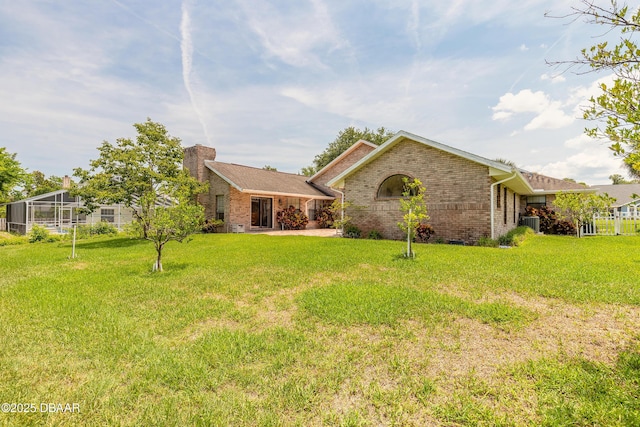7 Fernery Trl, Ormond Beach, FL 32174 - view of front facade with brick siding, a front lawn, and cooling unit