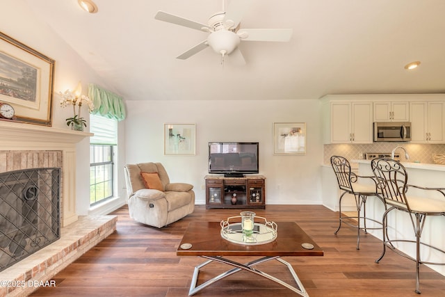 7 Fernery Trl, Ormond Beach, FL 32174 - living area featuring wood finished floors, a ceiling fan, a fireplace, baseboards, and recessed lighting