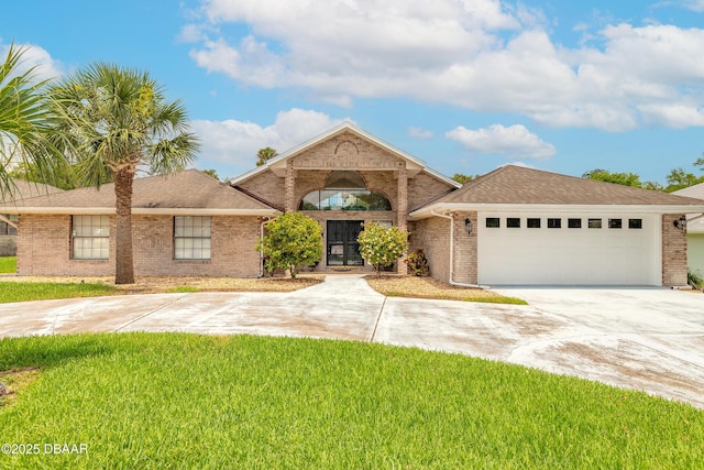 7 Fernery Trl, Ormond Beach, FL 32174 - single story home featuring brick siding, concrete driveway, an attached garage, and a front yard