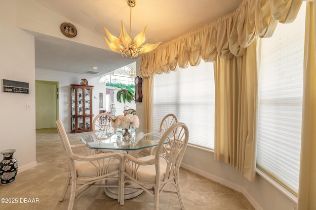 7 Fernery Trl, Ormond Beach, FL 32174 - dining space featuring baseboards, light tile patterned flooring, and lofted ceiling