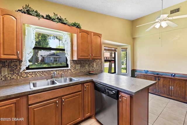 104 Herring Gull Ct, Daytona Beach, FL 32119 - kitchen with dishwasher, ceiling fan, a peninsula, tasteful backsplash, and a textured ceiling