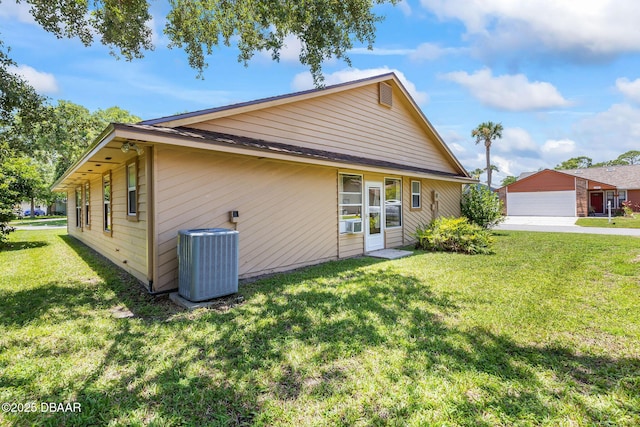 104 Herring Gull Ct, Daytona Beach, FL 32119 - back of property with a lawn and a garage