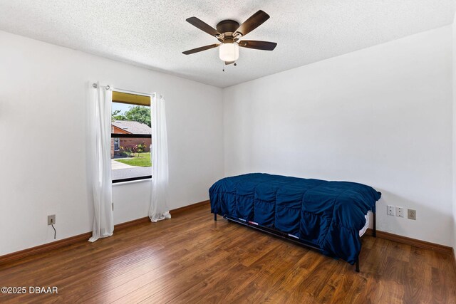 104 Herring Gull Ct, Daytona Beach, FL 32119 - bedroom with wood finished floors, a textured ceiling, and a ceiling fan