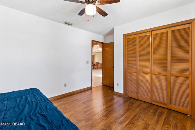 104 Herring Gull Ct, Daytona Beach, FL 32119 - unfurnished bedroom with a textured ceiling, wood finished floors, ceiling fan, and a closet