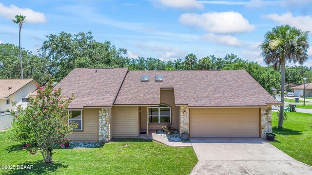 104 Herring Gull Ct, Daytona Beach, FL 32119 - mid-century home featuring stone siding, a shingled roof, a garage, a front yard, and concrete driveway
