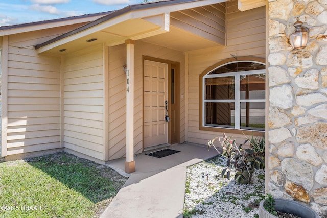 104 Herring Gull Ct, Daytona Beach, FL 32119 - doorway to property with stone siding